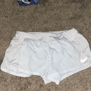 White Nike shorts